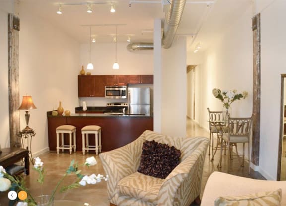 a living room with a couch a chair and a table