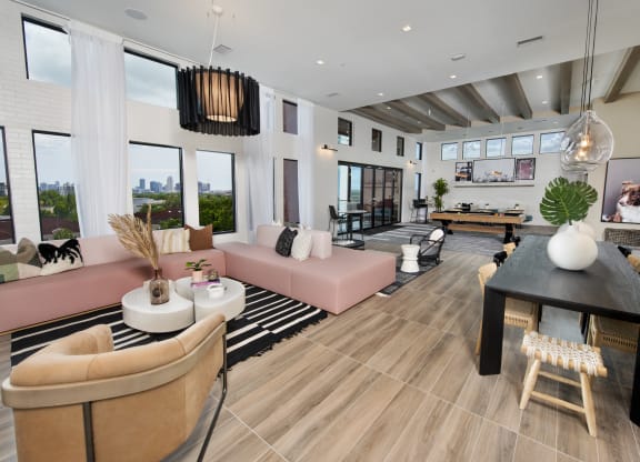 a living room with couches and a table with a ping pong