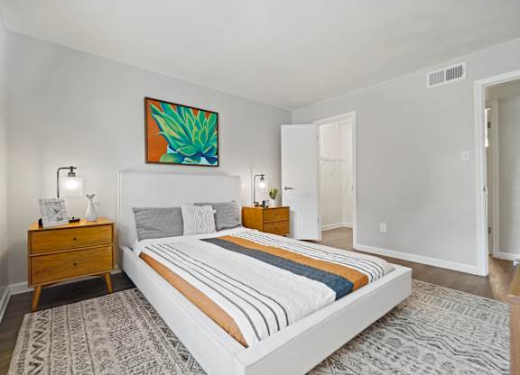 a bedroom with a bed and two night stands