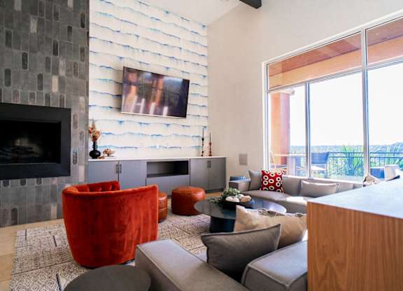A living room with a fireplace and a couch.