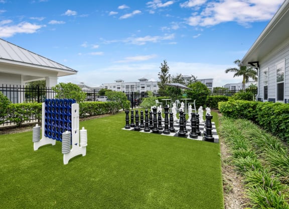 a large outdoor chess set on the lawn