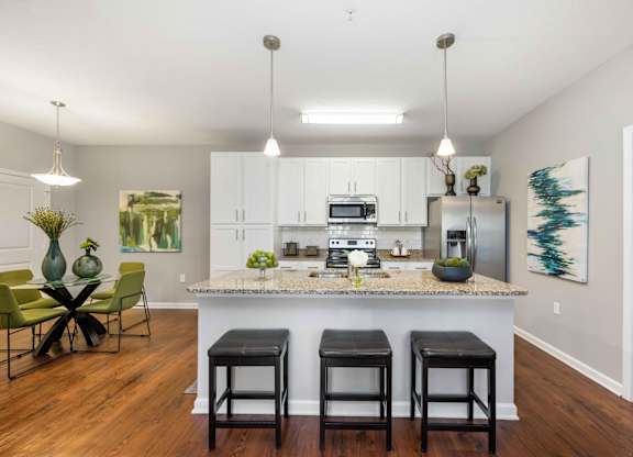 a kitchen and dining area in a 555 waverly unit