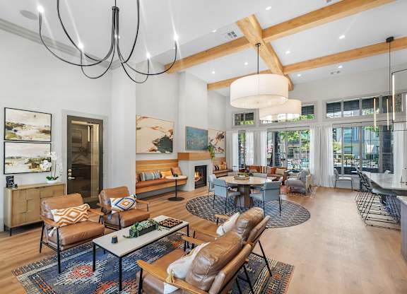 A modern living room with a fireplace and a dining table.