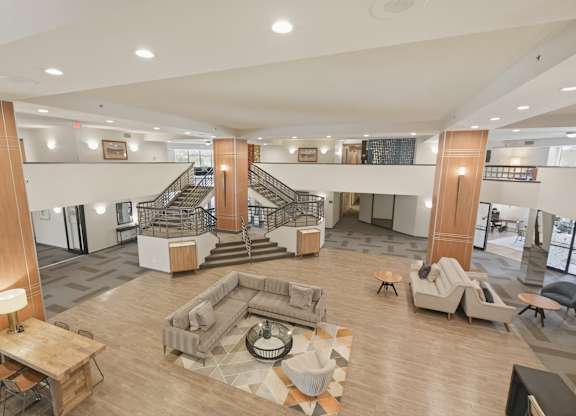 A large open space with a staircase and seating area.