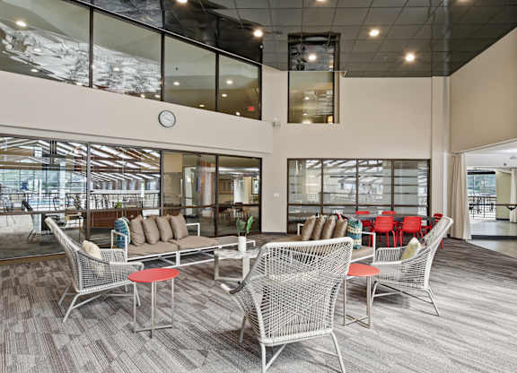 A large room with a lot of chairs and tables.