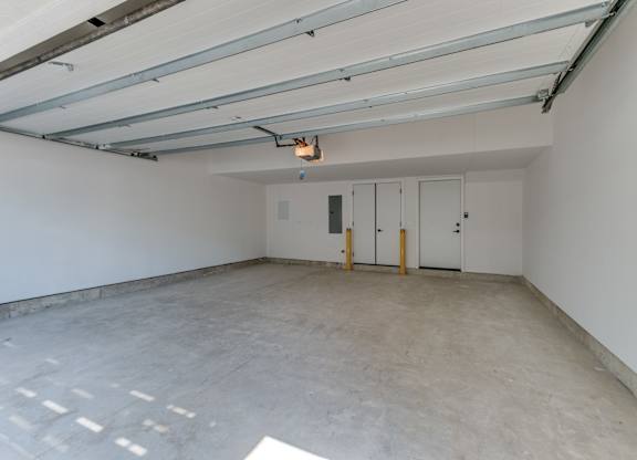 A large, private, two car garage with automated garage door and door leading to the inside of the townhome.