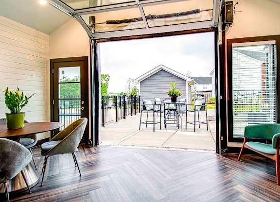 A patio with a table and chairs is shown.