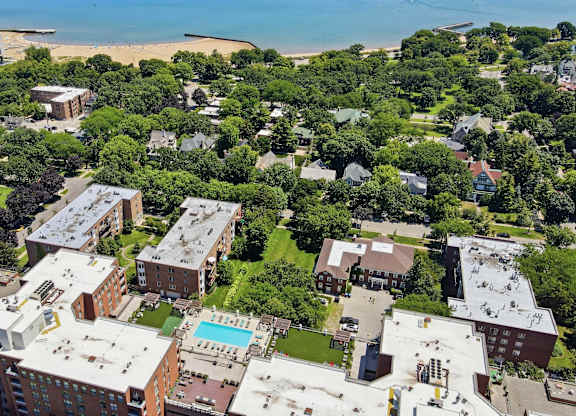 A bird's eye view from Evanston Place Apartments with a view of residential Evanston, beach, and Lake Michigan.