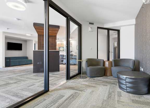 A conference room with assorted seating in the business center.