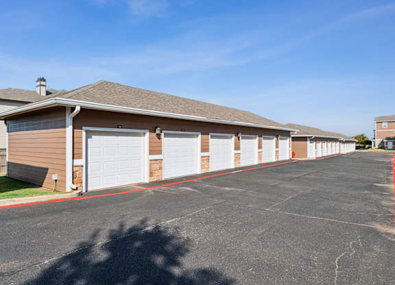 A long row of garage doors are closed.