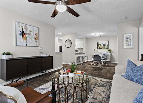 A living room with a brown and white color scheme.