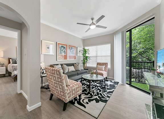 a living room with a couch and two chairs