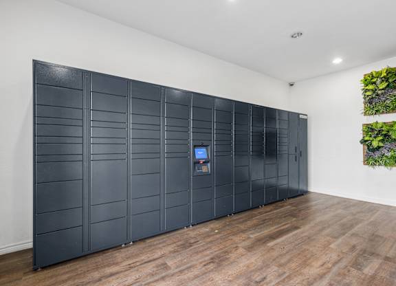 A wall of black panels with a small screen on the left side.
