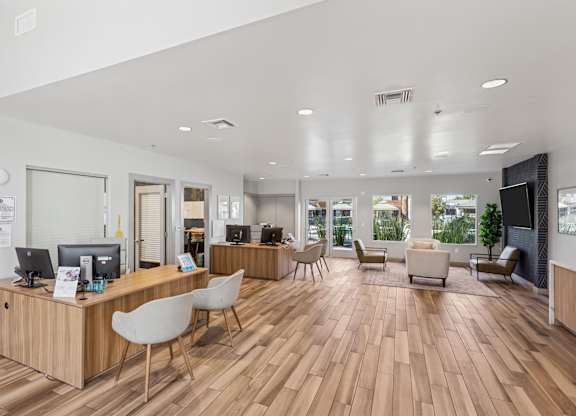 A reception area with a desk and chairs.
