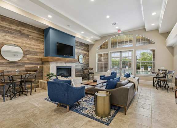 A living room with a fireplace and a television.