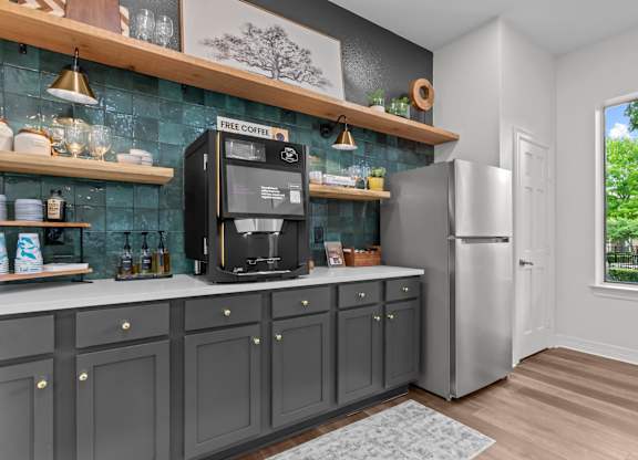 A kitchen with a coffee machine on the counter.