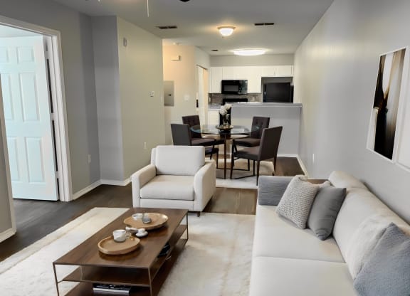 a living room and dining room with a couch and a table