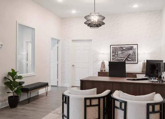 a home office with a desk and three chairs