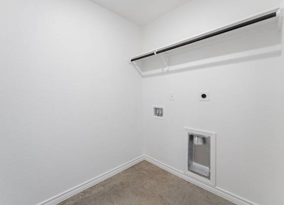 a white room with a white wall and a window and a door