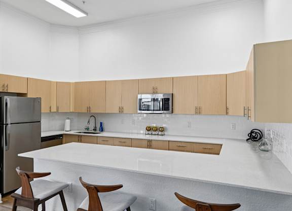 A kitchen with wooden cabinets and a white countertop.