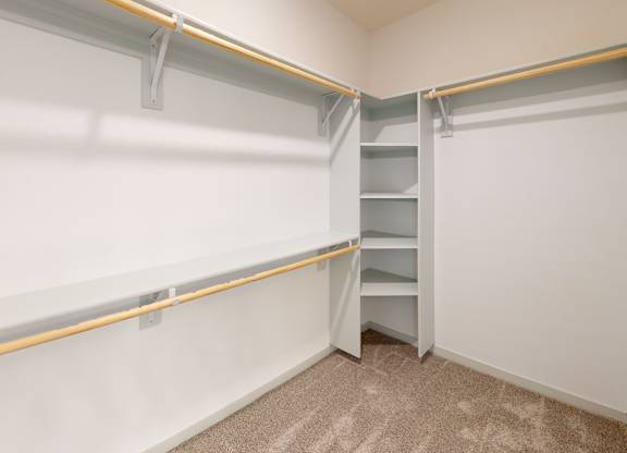 A white wall with a yellow line and a white shelf.