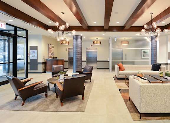 A modern living room with a fireplace and a couch.