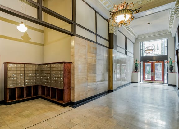 a large room with a large window and a large wooden desk with a glass door in the