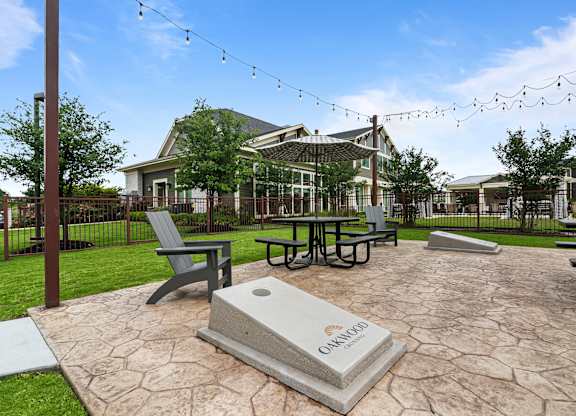 A stone monument with the word Omaha on it sits in the middle of a courtyard.