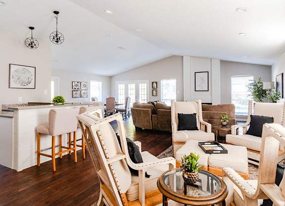 A living room with a white couch and a coffee table.