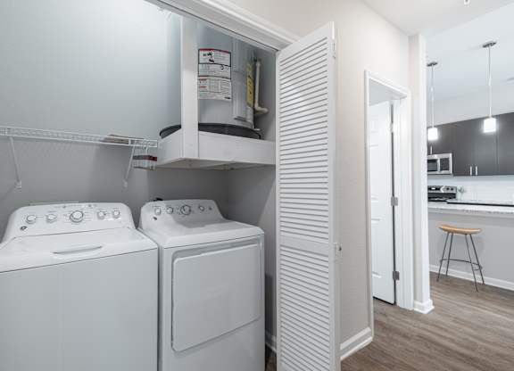A laundry room with a washer and dryer.