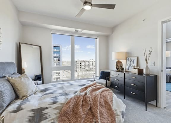 Furnished bedroom with ample lighting