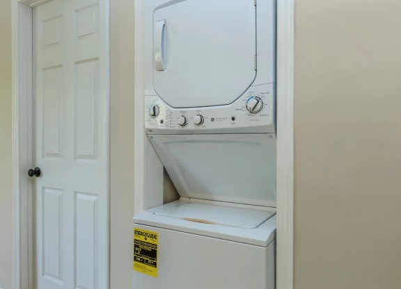 a washer and dryer are located in the laundry room
