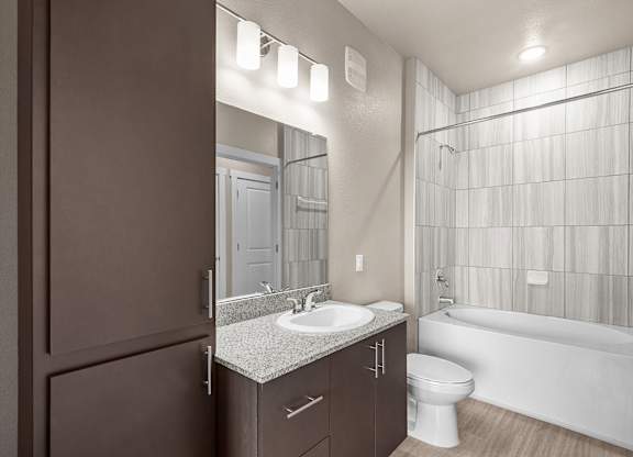 a bathroom with a sink toilet and a shower