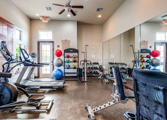 the gym with cardio equipment at the belgard apartments mn