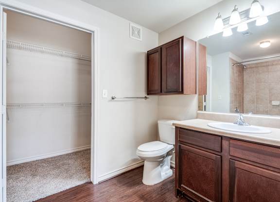 an empty bathroom with a toilet and a sink