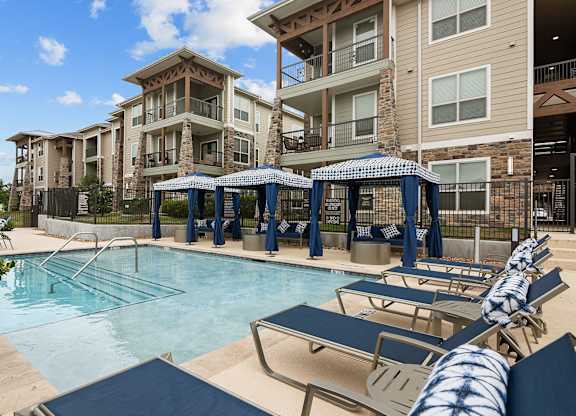our apartments have a large swimming pool with lounge chairs
