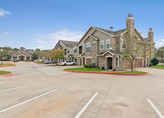 A large house with a driveway in front of it.