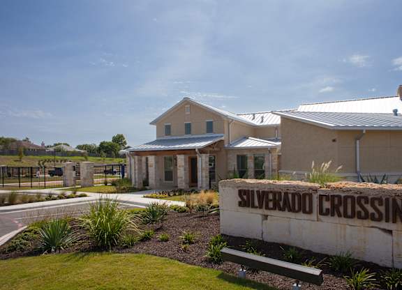 A building with a sign that says Silverado Crossing in front of it.