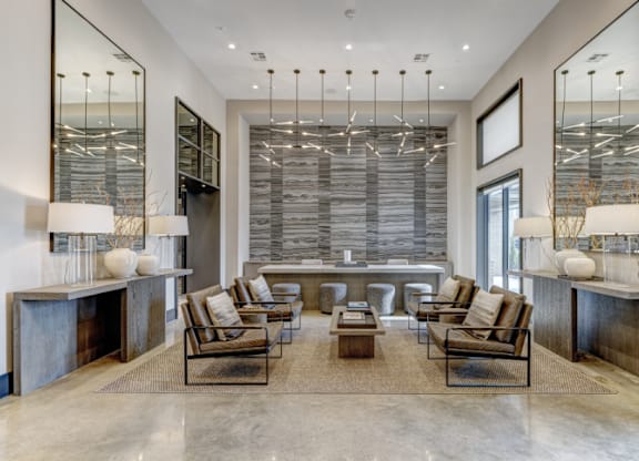 A modern living room with a large window and a long table.