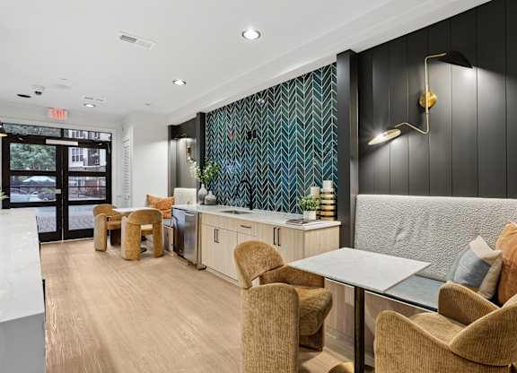 A modern dining area with a table and chairs.