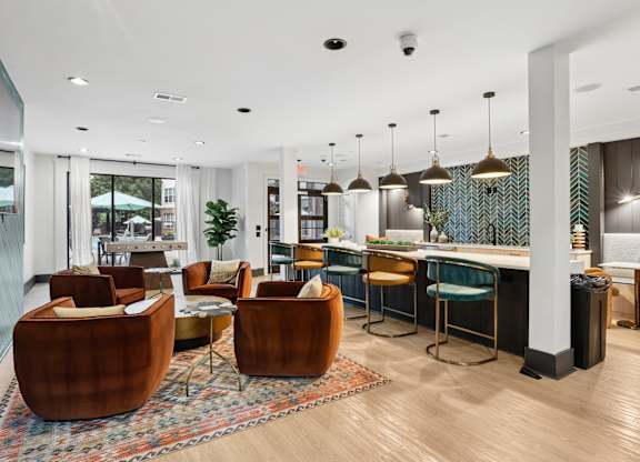 A modern living room with a bar area and comfortable seating.