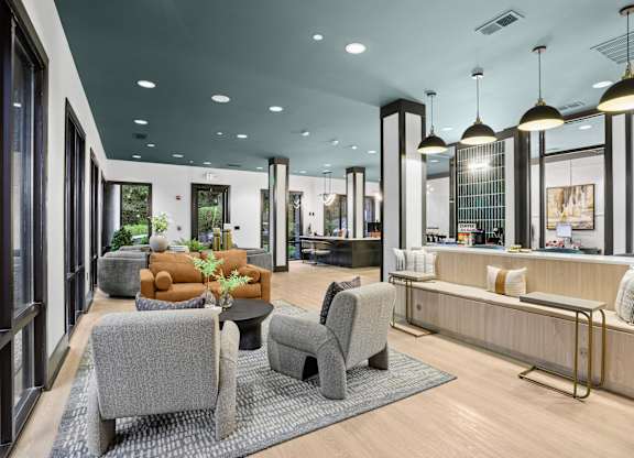 A modern living room with grey and brown furniture.