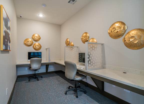a view of a room with computers and gold balls on the wall