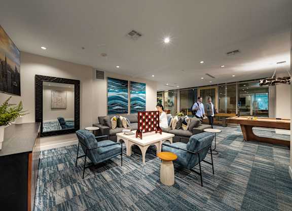 a living room with couches and chairs and a table