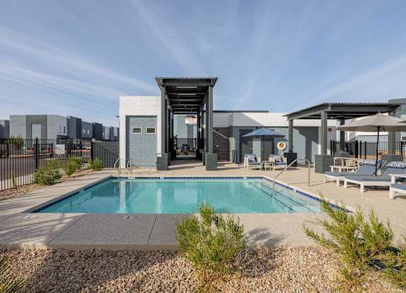 A modern house with a pool in the backyard.