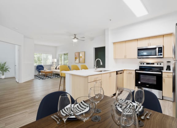 A spacious dine in kitchen with a table and chairs