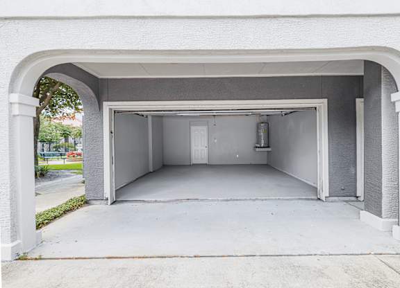 A white garage door is open.