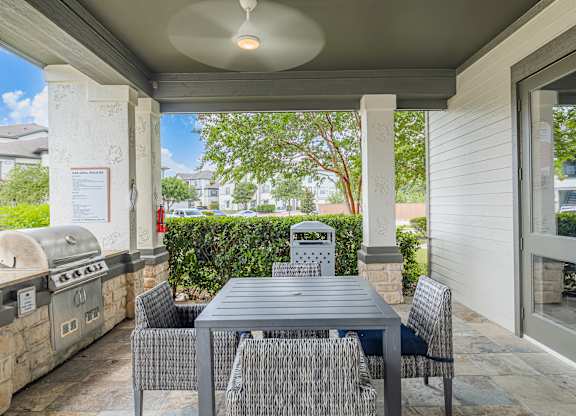 A patio with a table and chairs is shown.