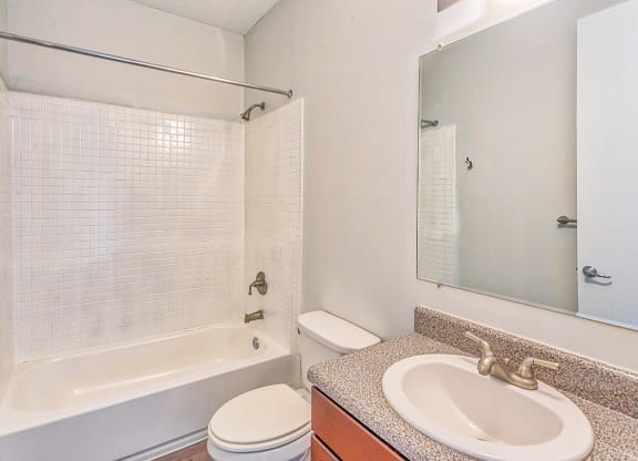 a bathroom with a sink toilet and bathtub