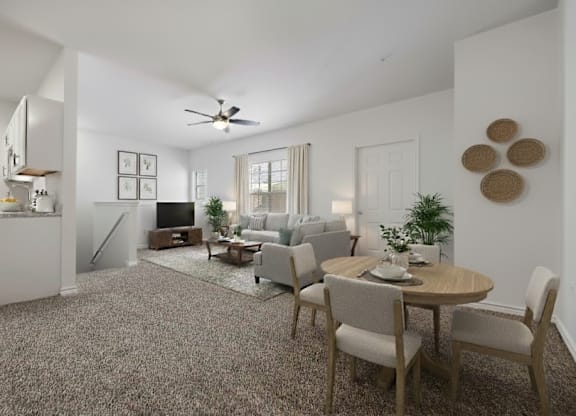 A living room with a dining table and chairs.